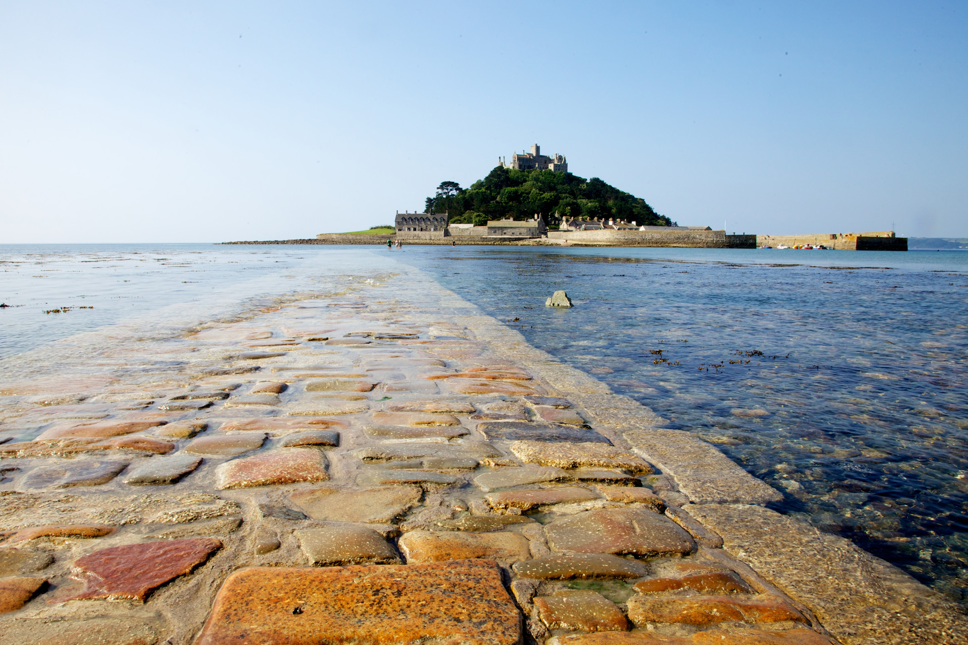 Photo Taken at St Michael`s Mount near Marazion Cronwell England as the sea is going out revealing the stone causeway and we are the first to walk to island :) It was a good day out well worth a visit .