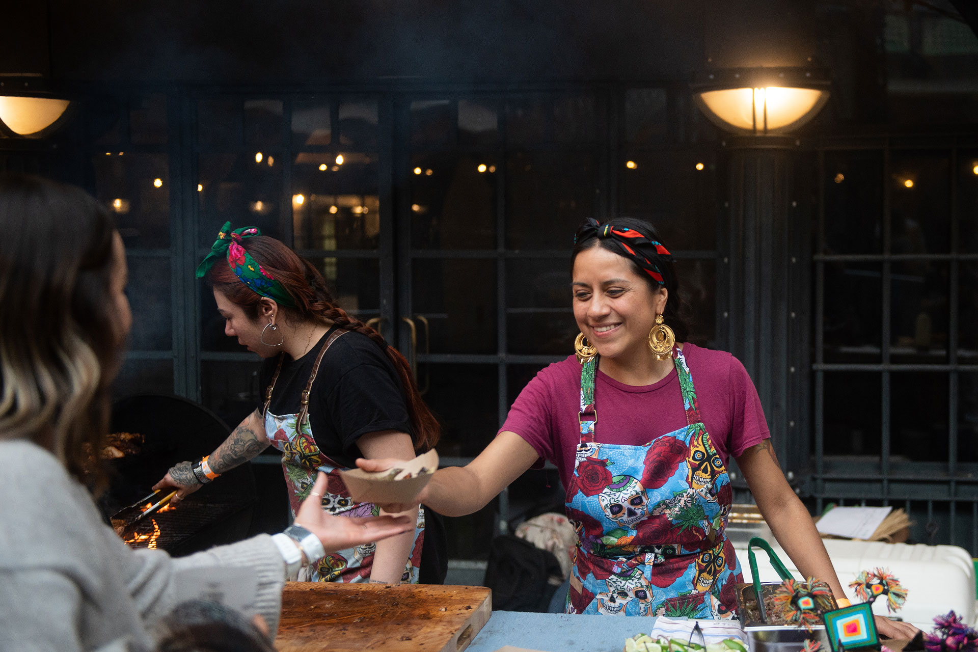Woman serving food at Meatopia festival