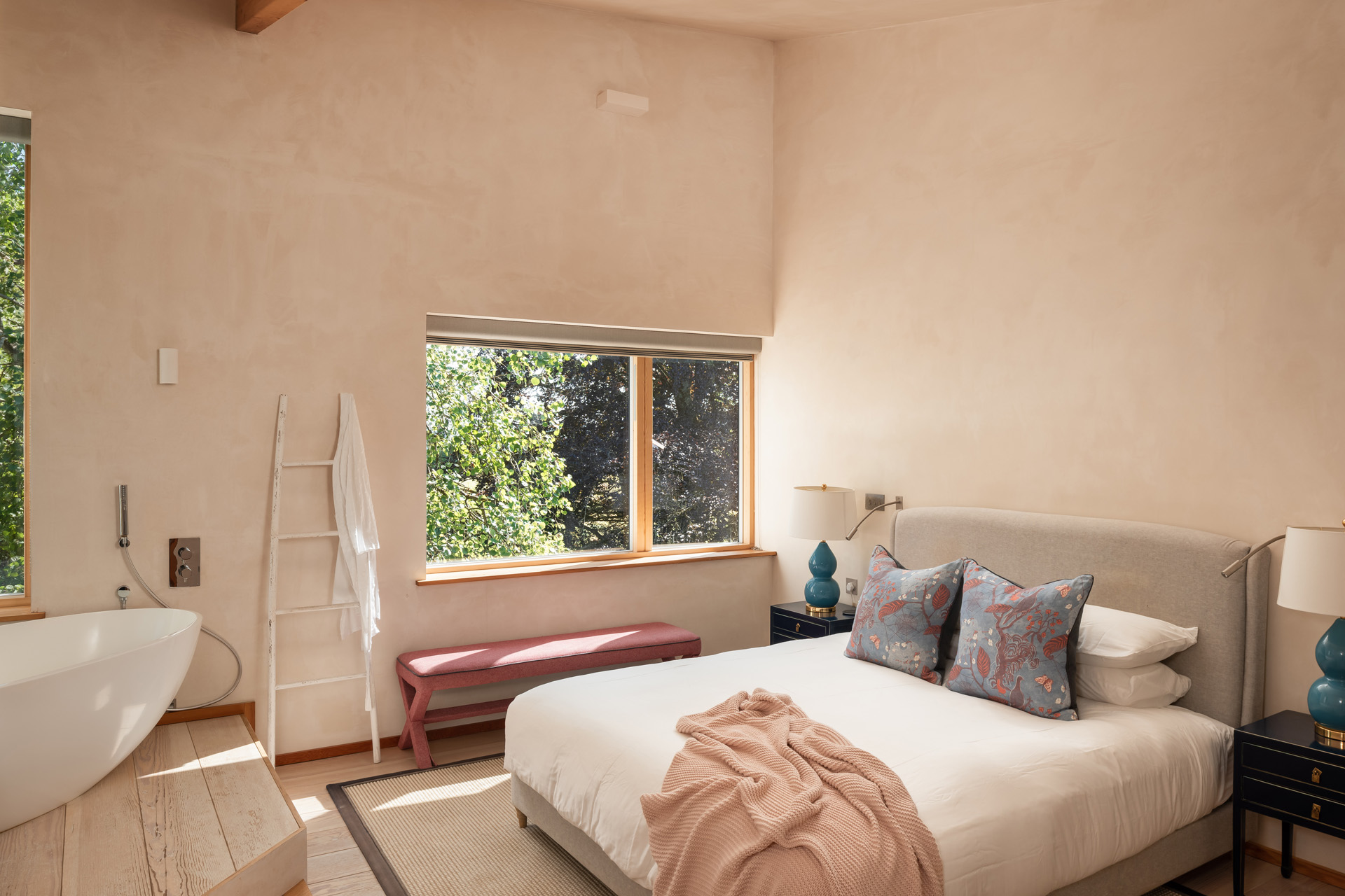 a light bedroom with large bed
