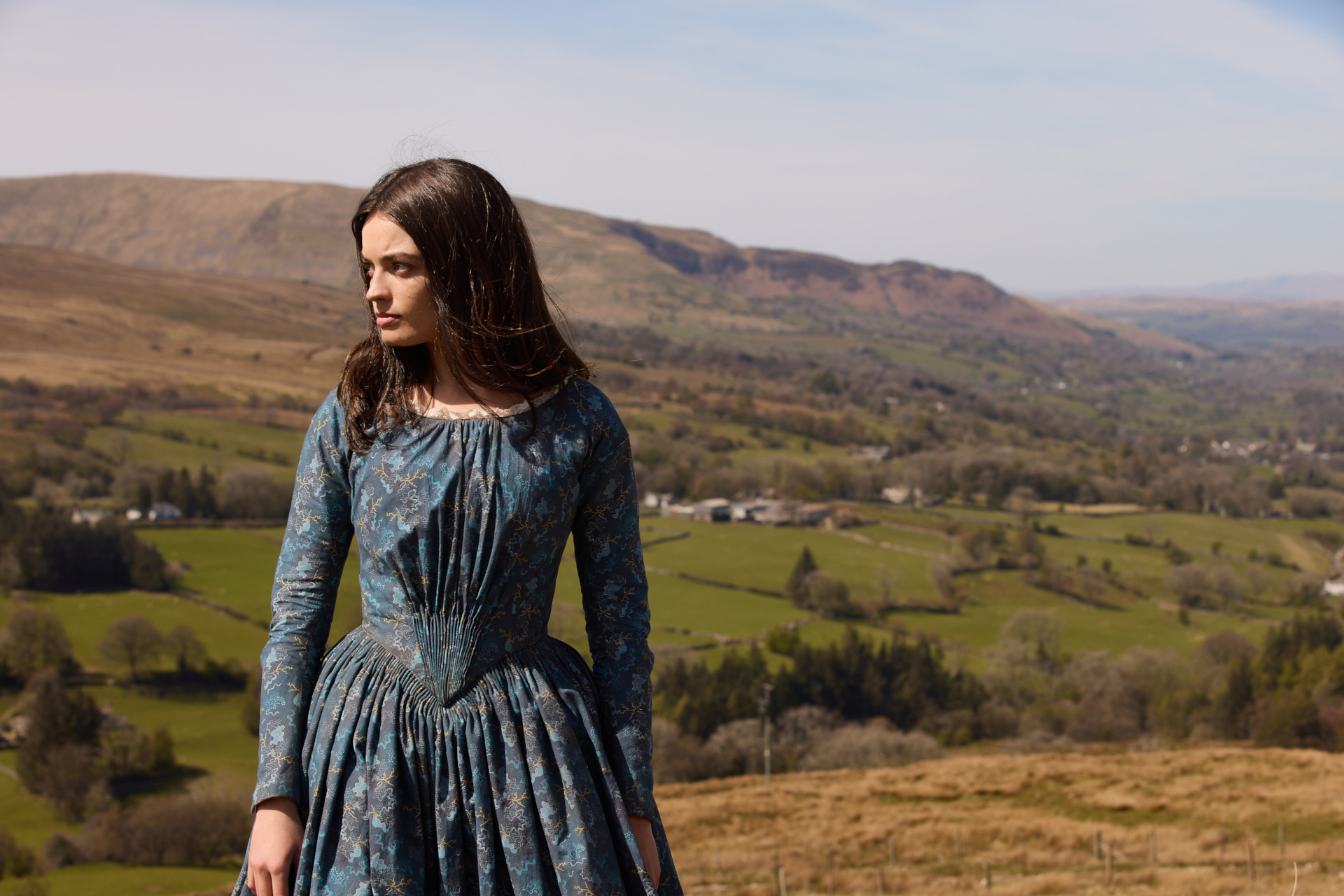 Emma Mackey in period costume on the Yorkshire moors