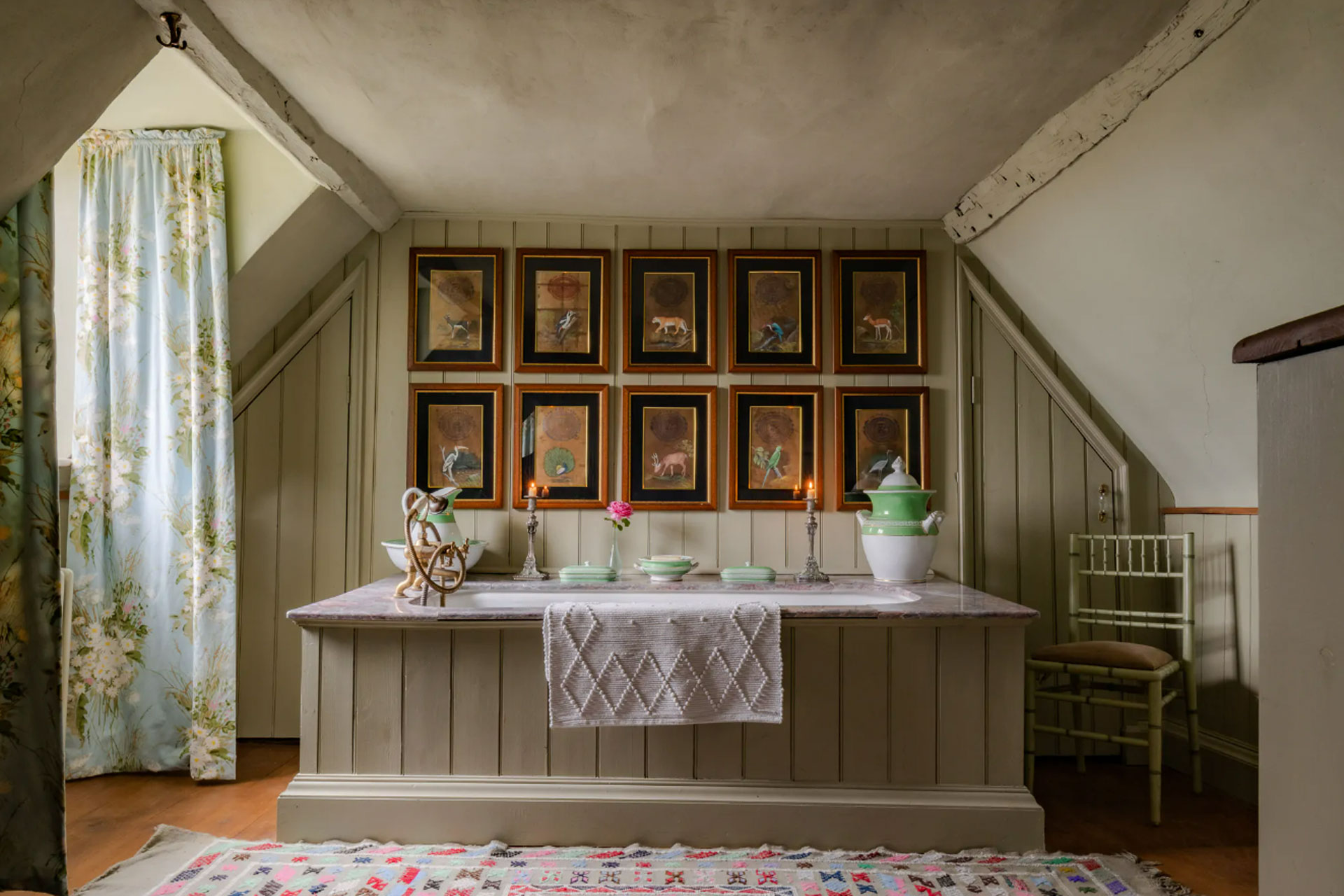 Edward Bulmer Paint used in a bathroom with wood panelling that's been painted a light sage green