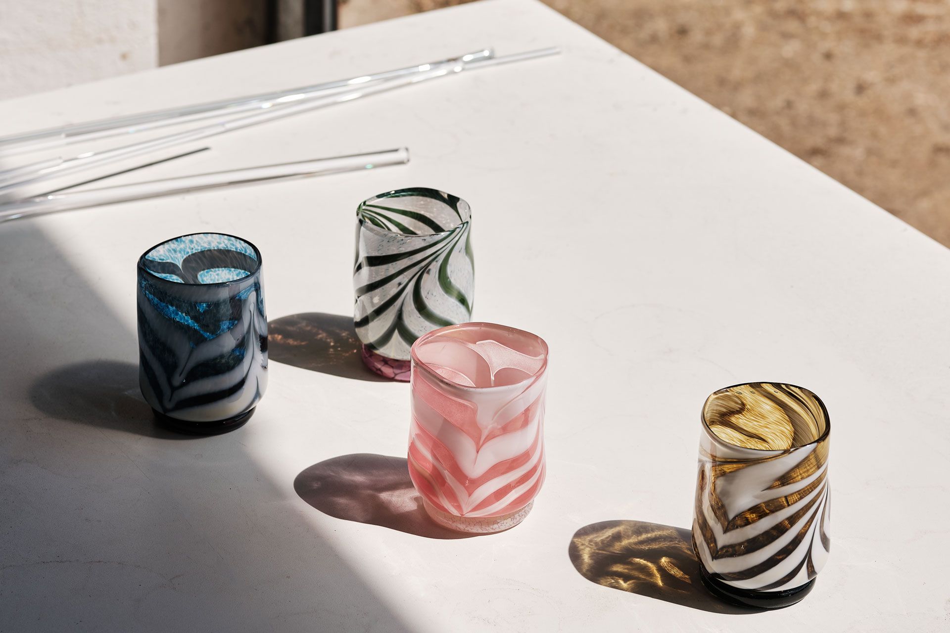 Henry Holland's new glassware collection with a group of four tumblers in different colours