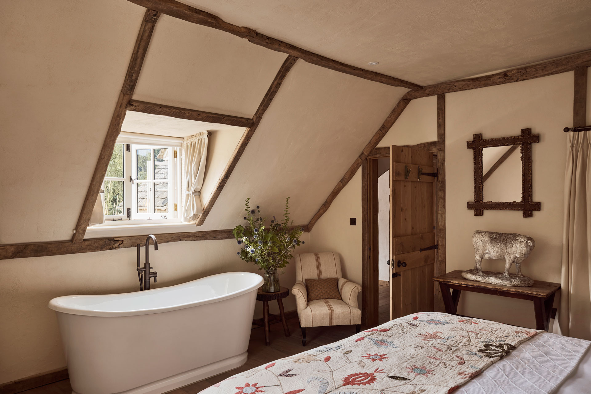 a freestanding bath features in The Hunting Lodge at Oddington's new hotel.