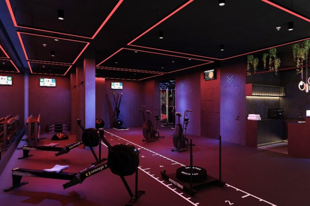 A gym in low, red and purple lights