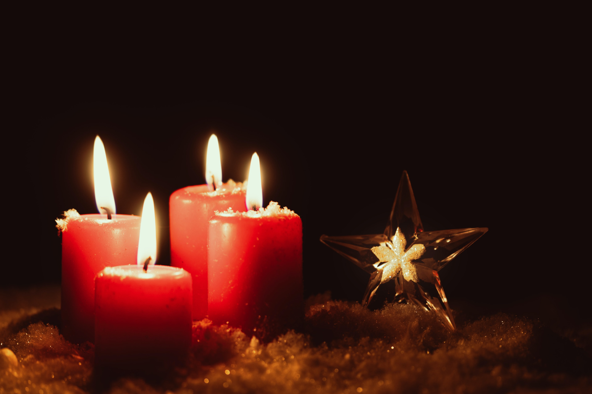 Red candles next to gold star |British fragrances Christmas