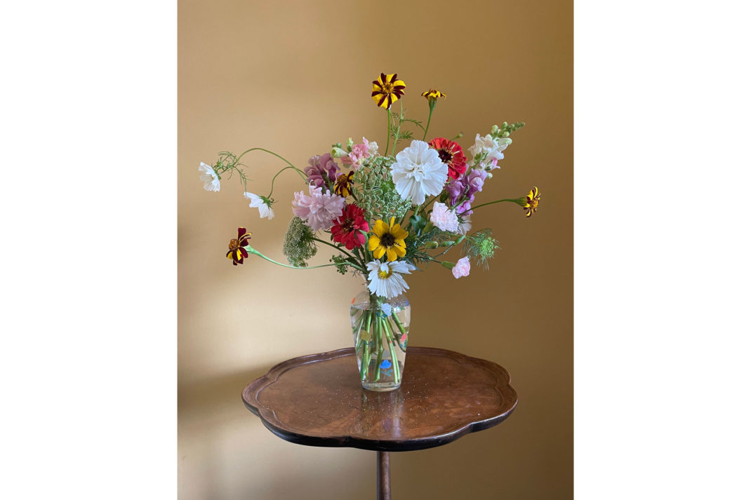 a bouquet of spindly wild flowers on a table by Uncut Stems