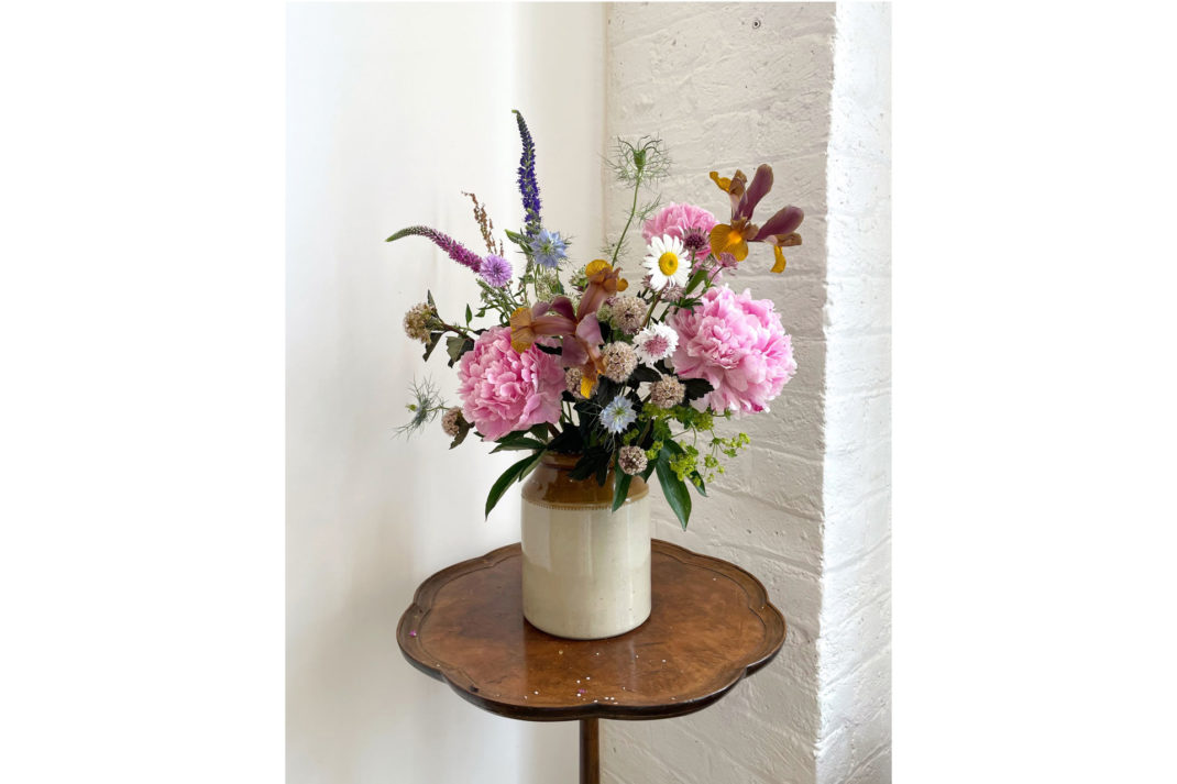 a bouquet of flowers in a jar by Uncut Stems