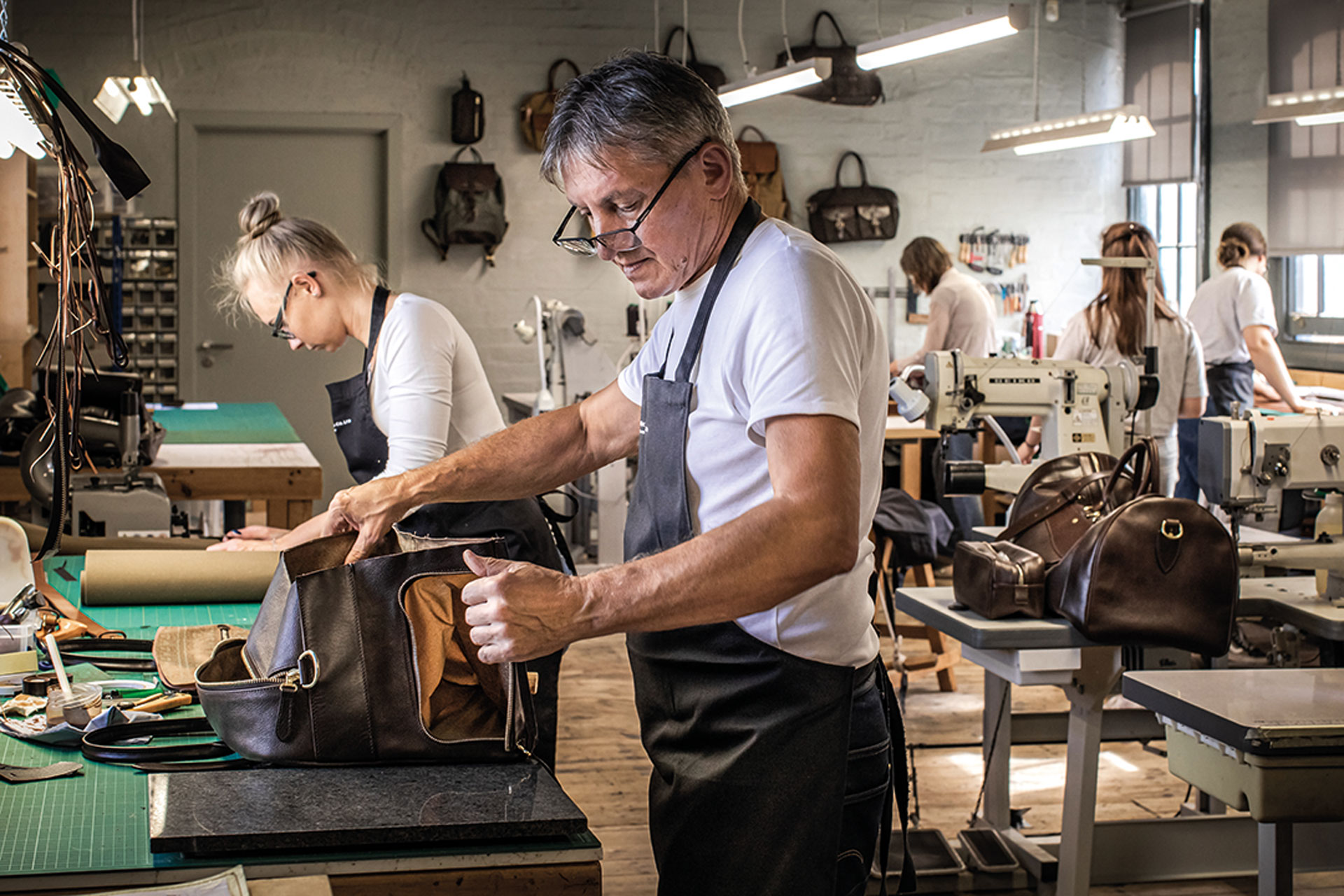 Man working in doors with leather and equipment