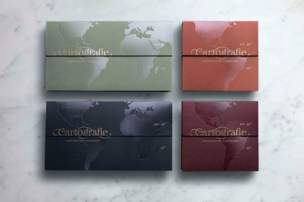 Boxes of chocolates laid out on marble counter