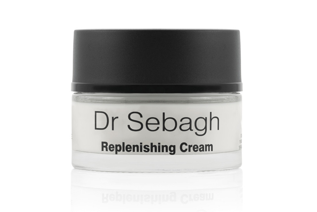 Tub of skin cream with black lid