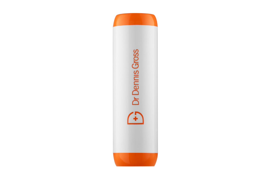 White tube with orange top and bottom and writing on the side