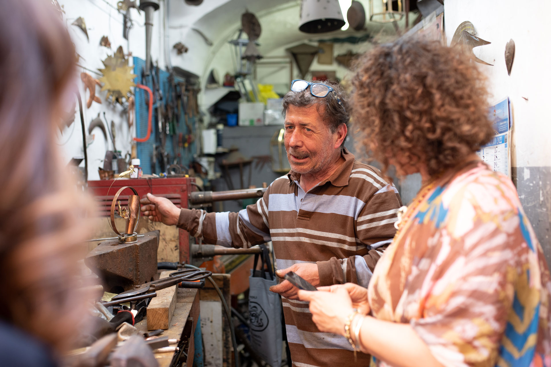 Man and woman observing copper constructions