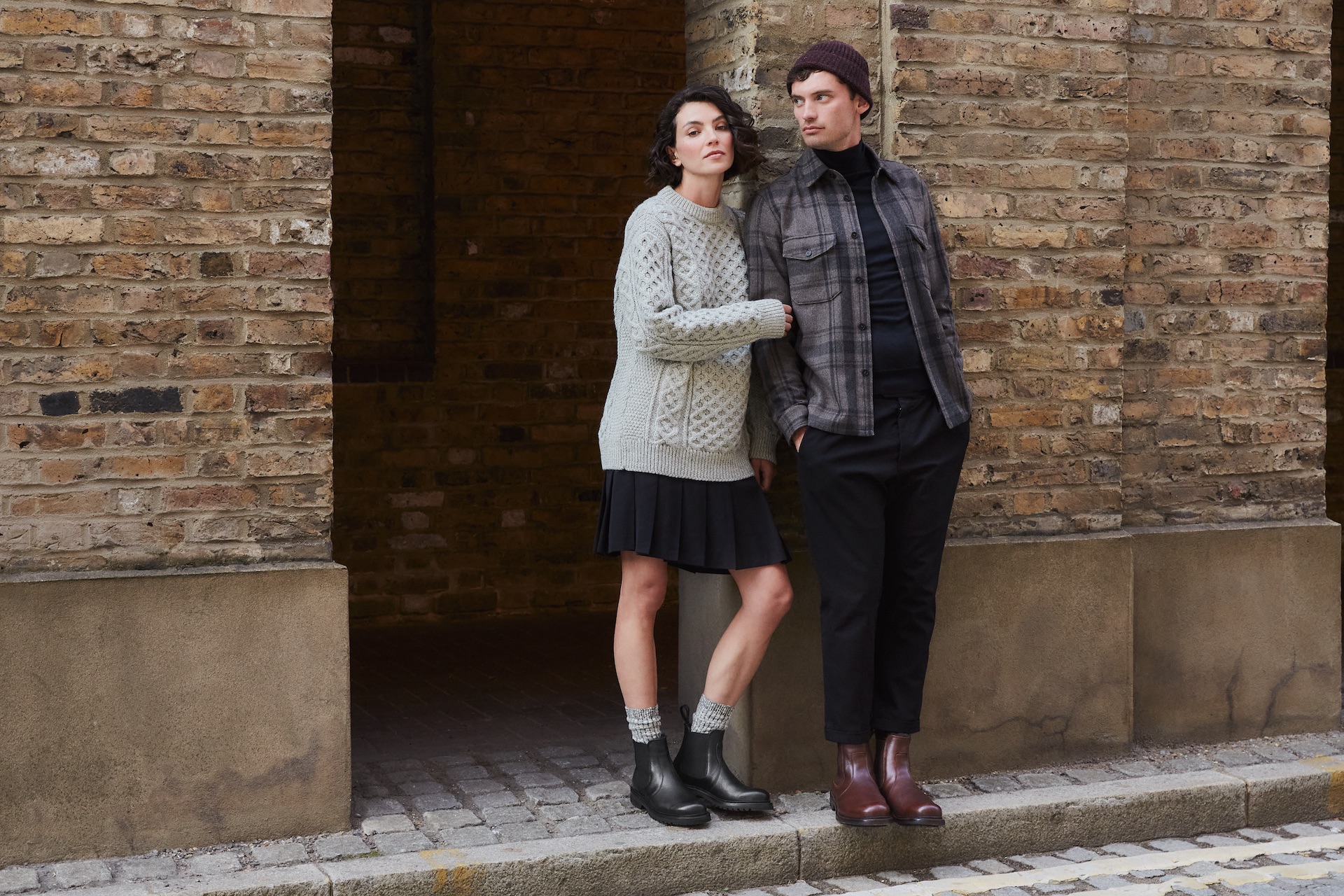 Man and a woman wearing leather ankle boots on the street