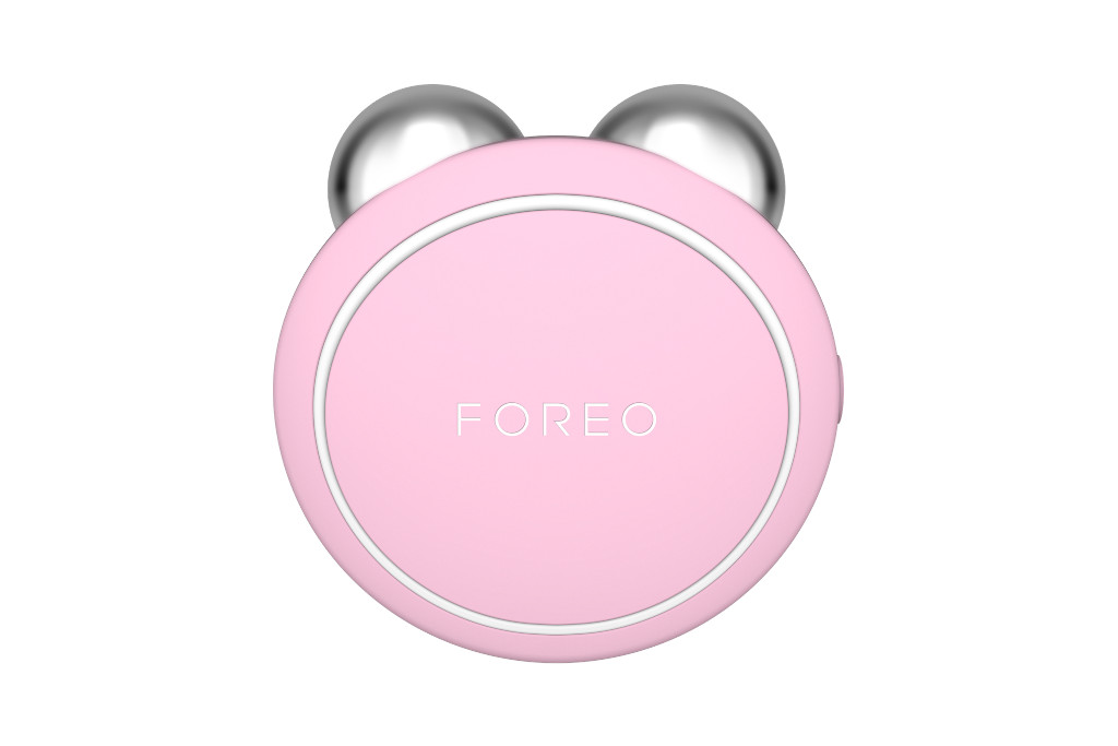 Pink circular tool with silver balls at the top