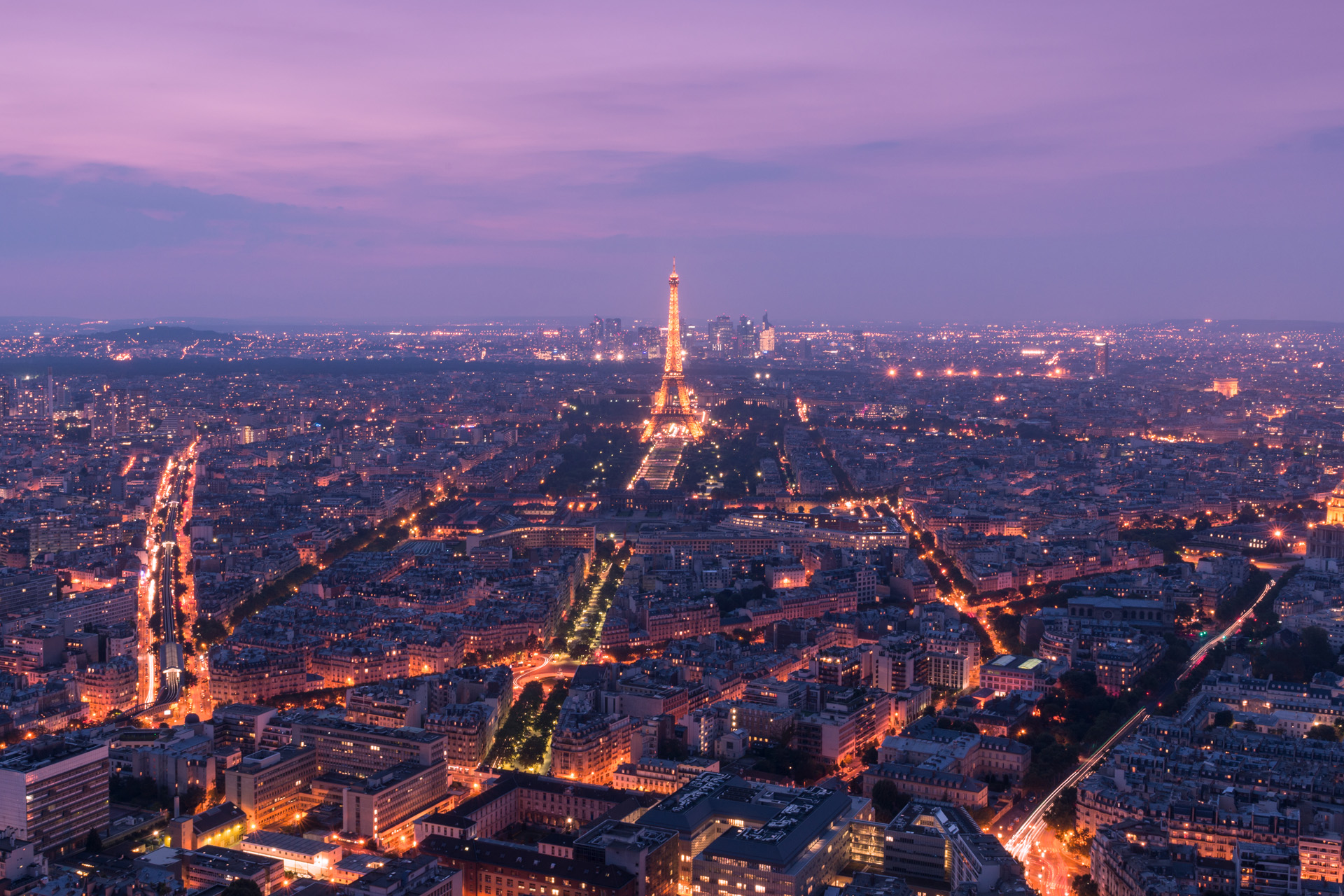 Paris, France - August 28, 2013: An aerial view of the city of Paris, France at dusk with the Eiffel Tower in the Centre.