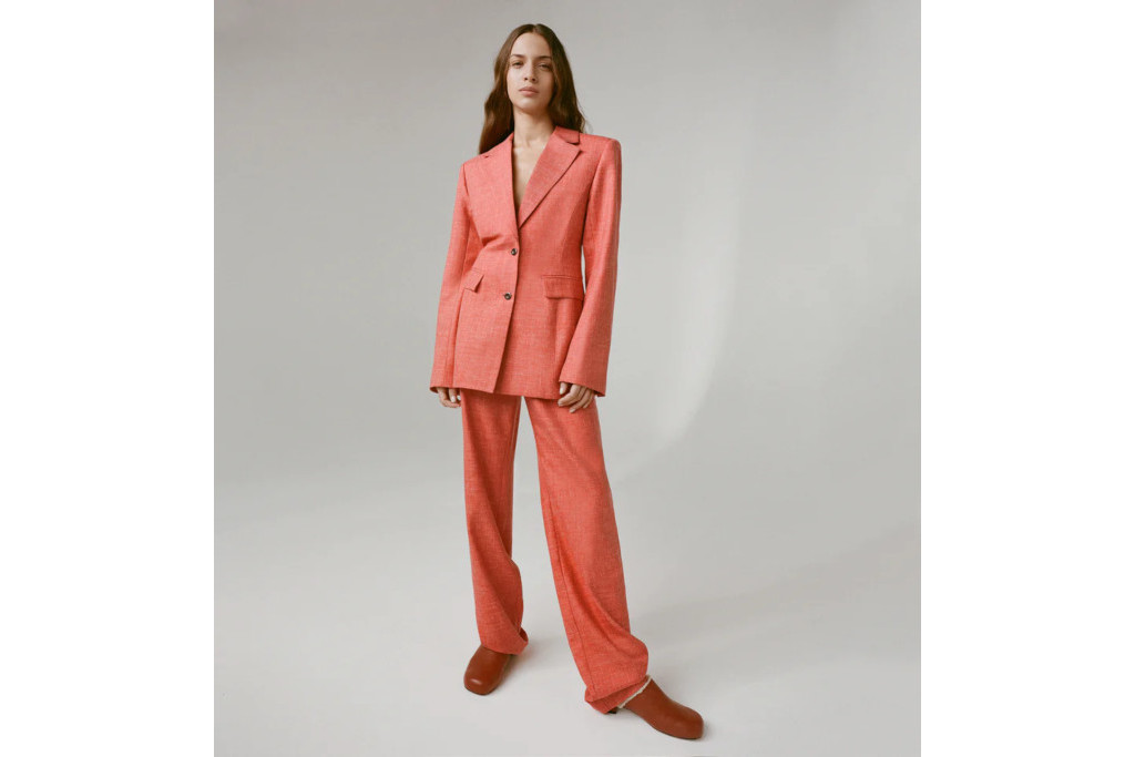 Woman in light red suit