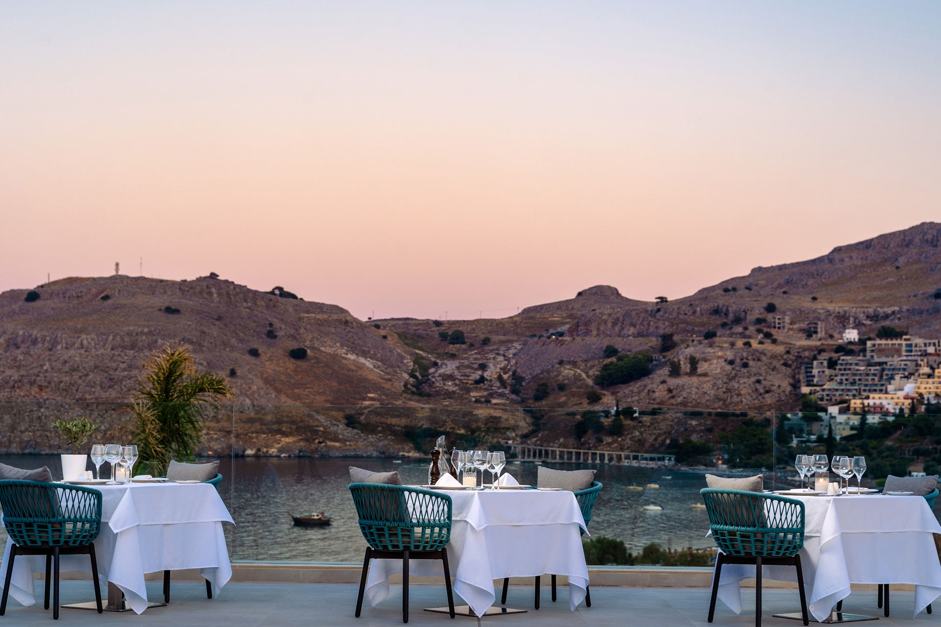 a sunset over greek hills