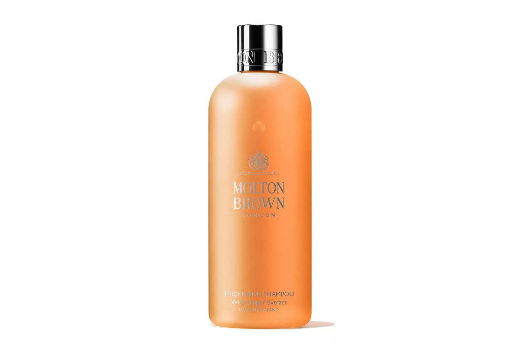 Bottle of orange-coloured gel shampoo