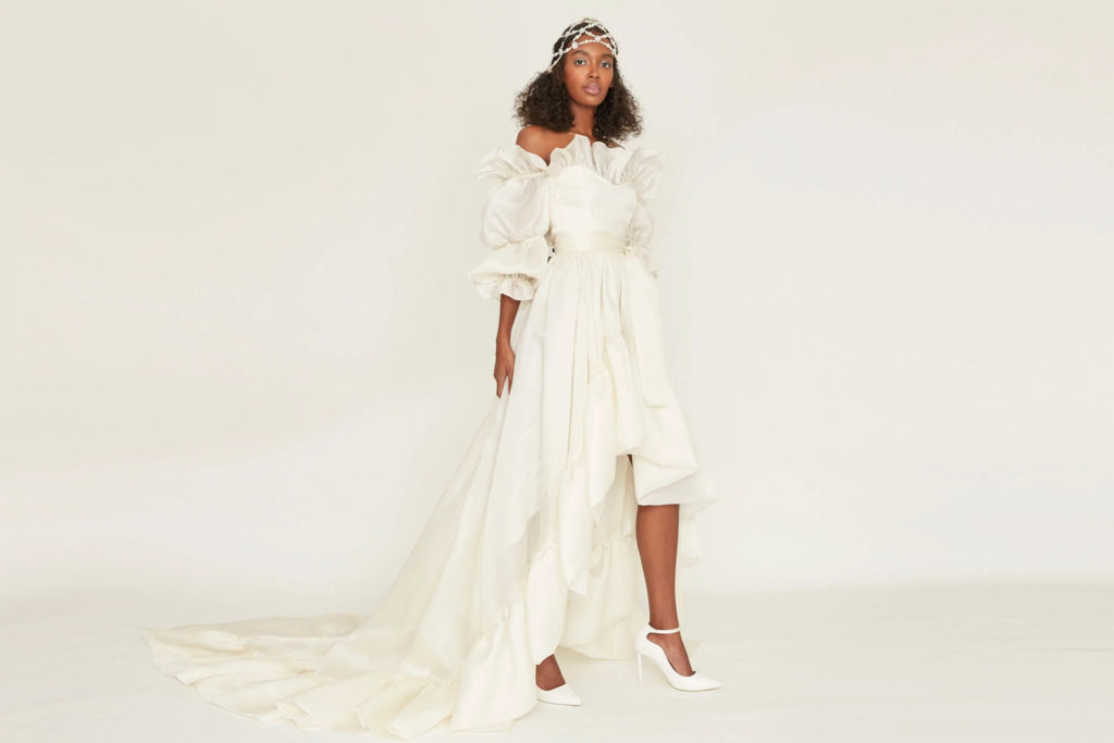 Woman in ivory gown with puff sleeves