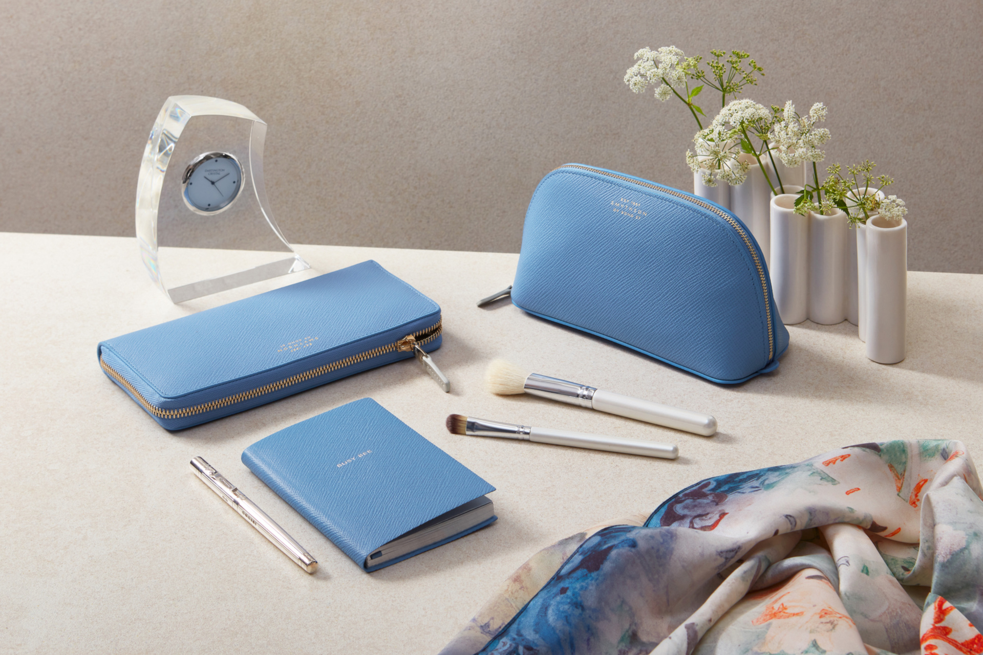 Table with blue bag and notebooks