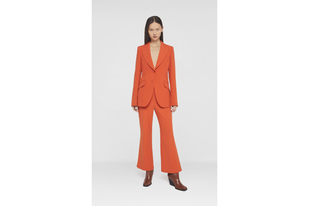Model in dark orange suit