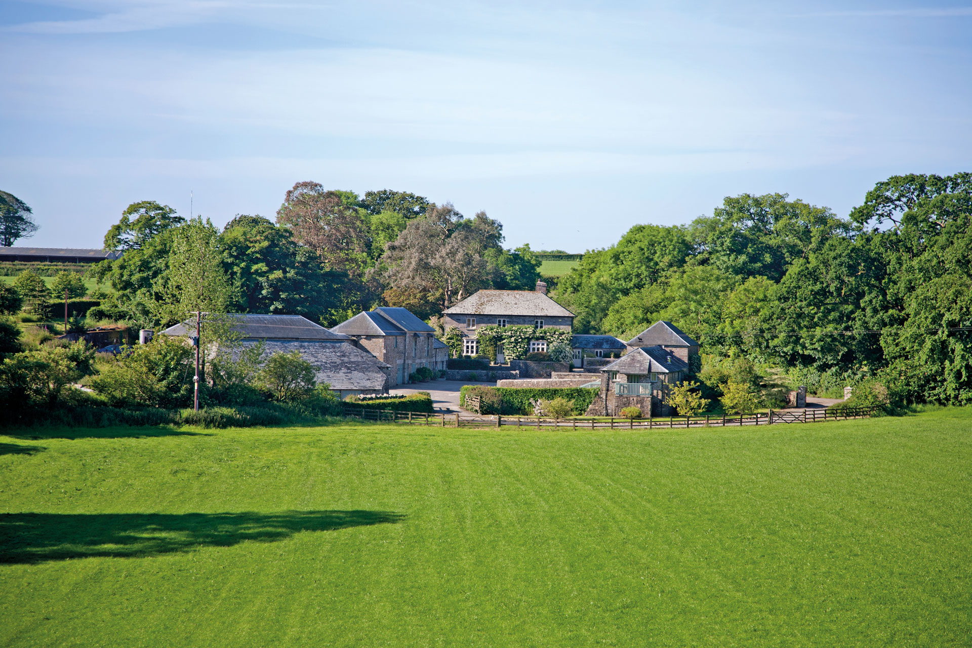 Building in the distance of a field 