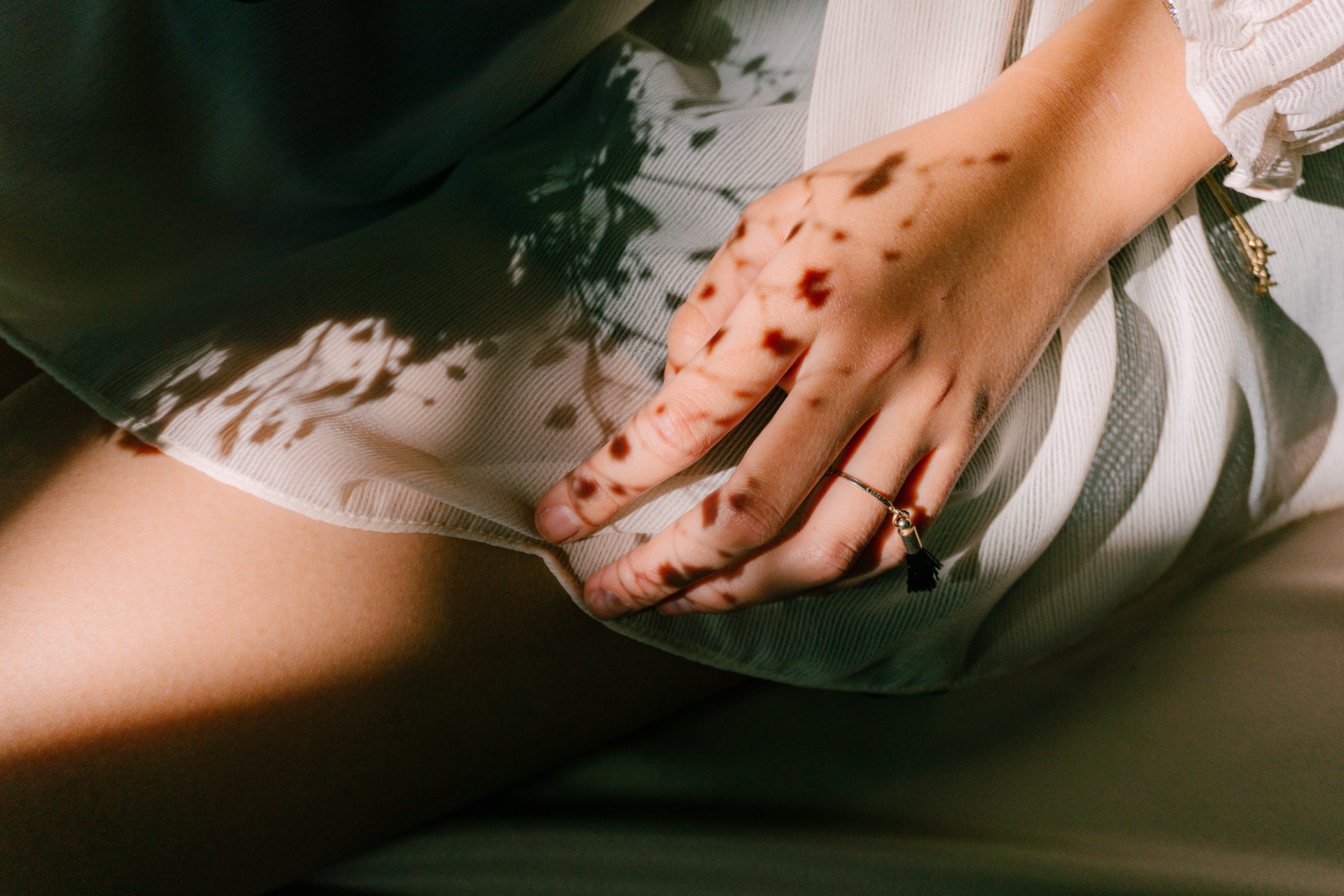 Shadows of flowers on hand