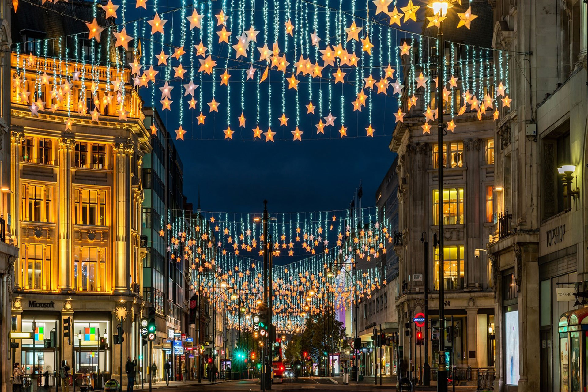 thousands of christmas lights at Oxford Street in the shape of stars hang