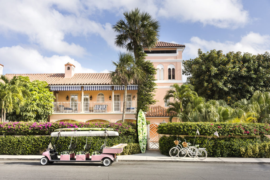 the pink exterior of The Colony Palm Beach