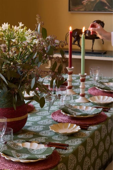 Table laid with green, pink and red decorations