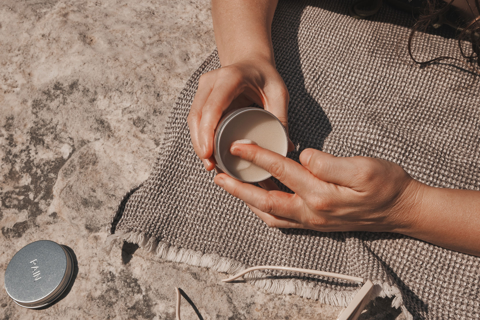 digging into container of cream