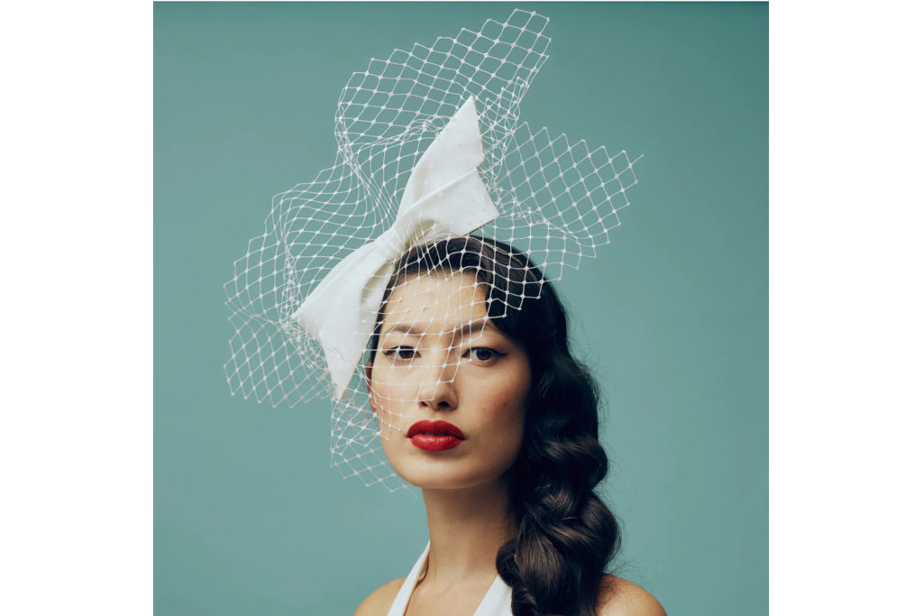 Model in white blusher on blue background