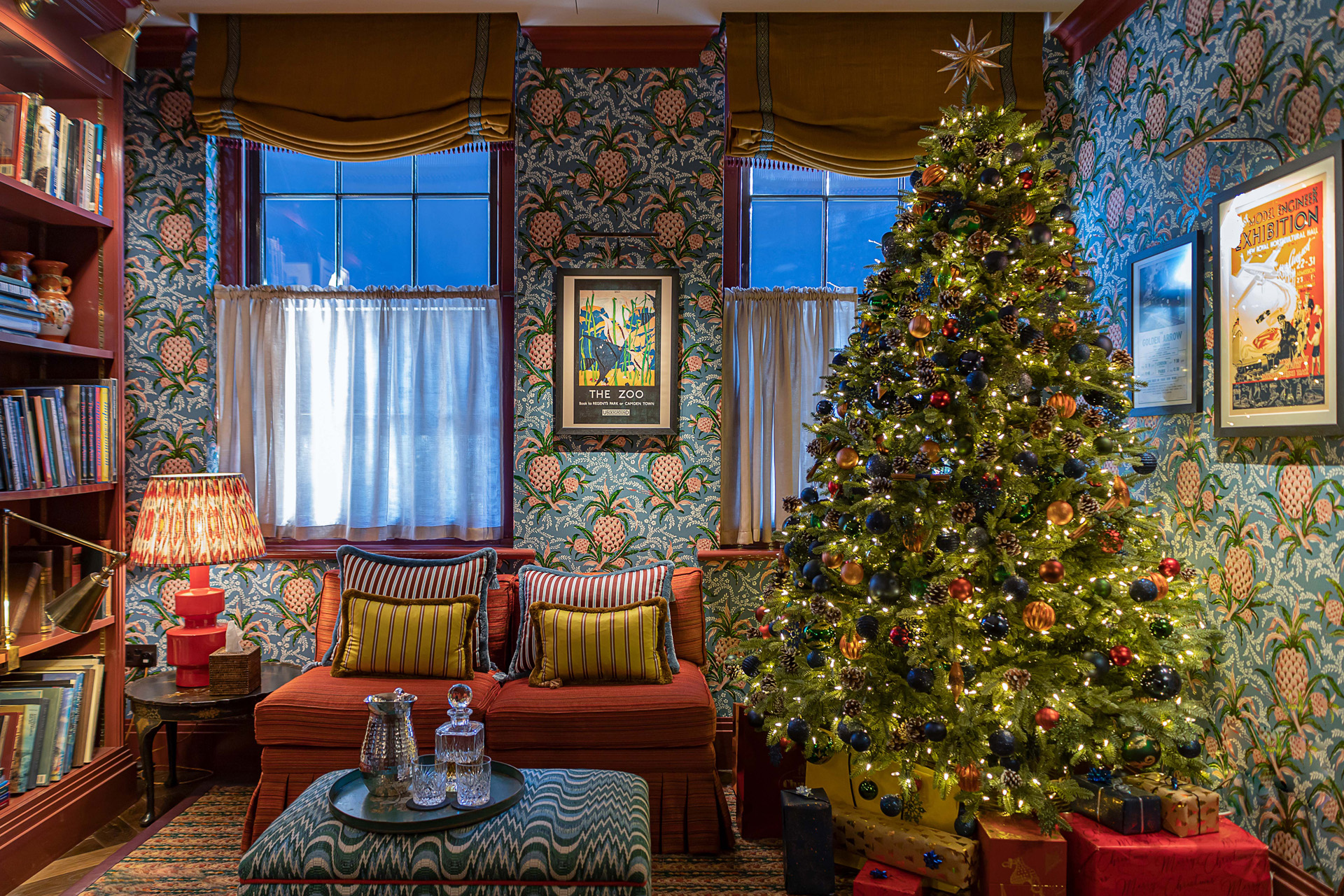 a tall decorated christmas tree in a living room at Beaverbrook Town house