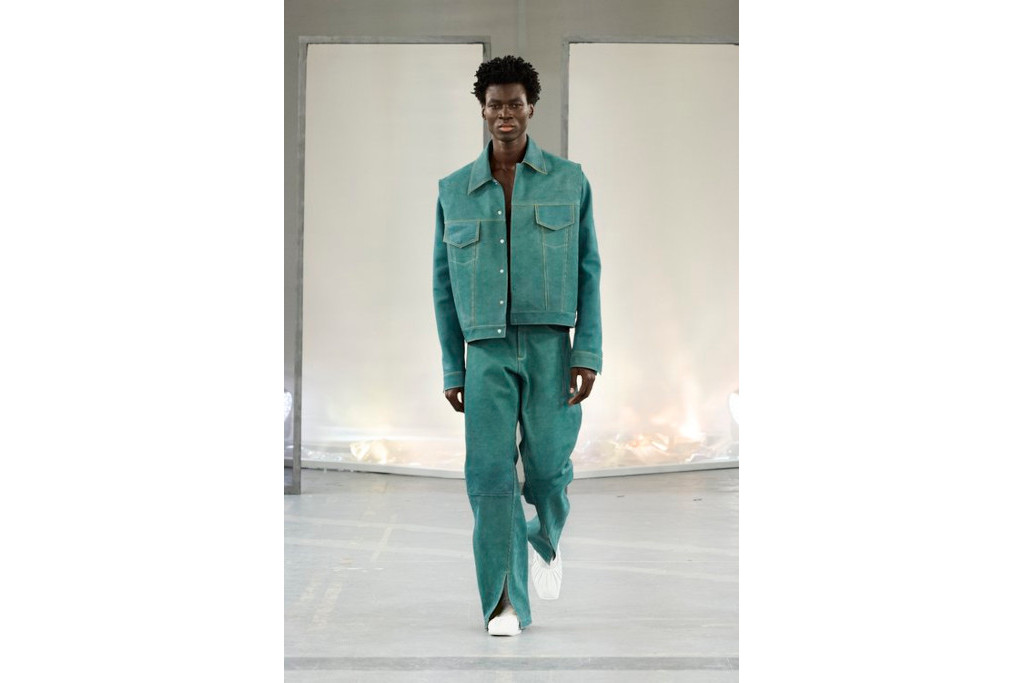 Man in turquoise denim co-ord walking runway