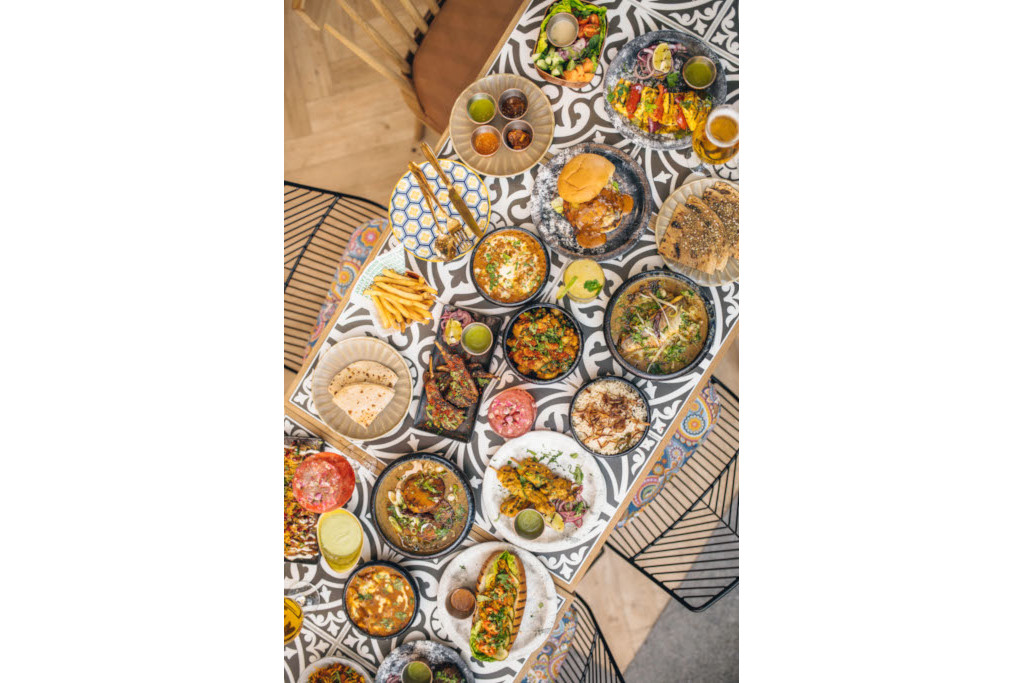 Table spread with feast of Indian dishes
