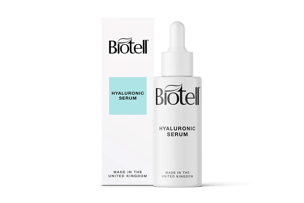 White serum bottle next to white box