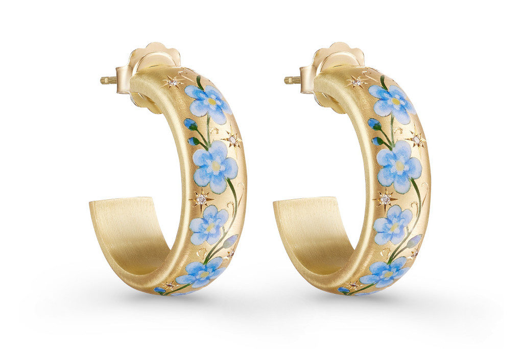 Gold hoops with blue flowers painted on them