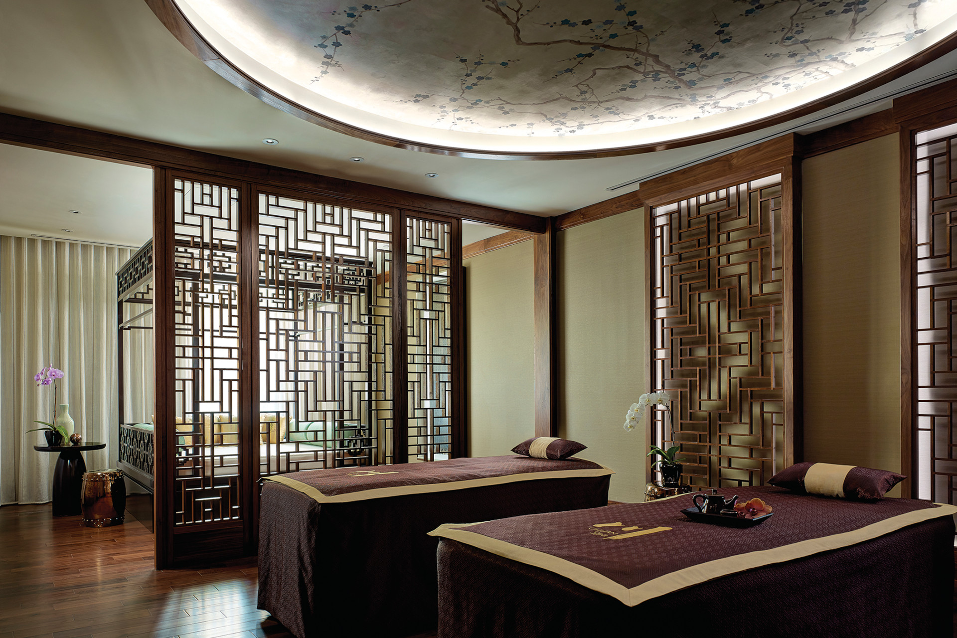 Treatment room at a spa with asian-inspired decor