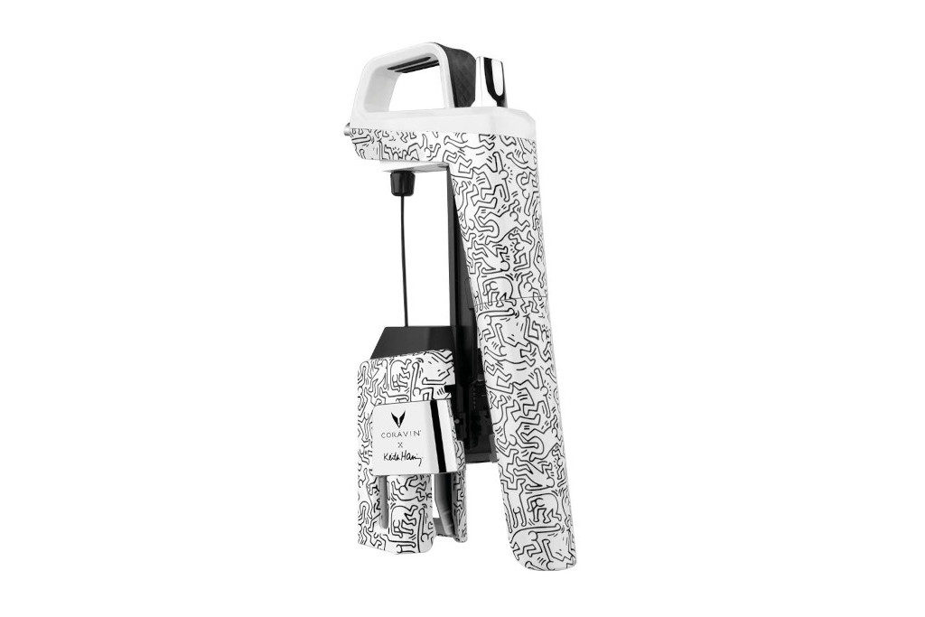 Wine pourer and stopper with illustrated designs