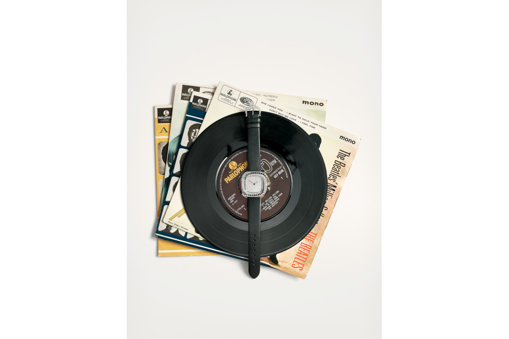 Eatch balanced on vinyl record and sleeves