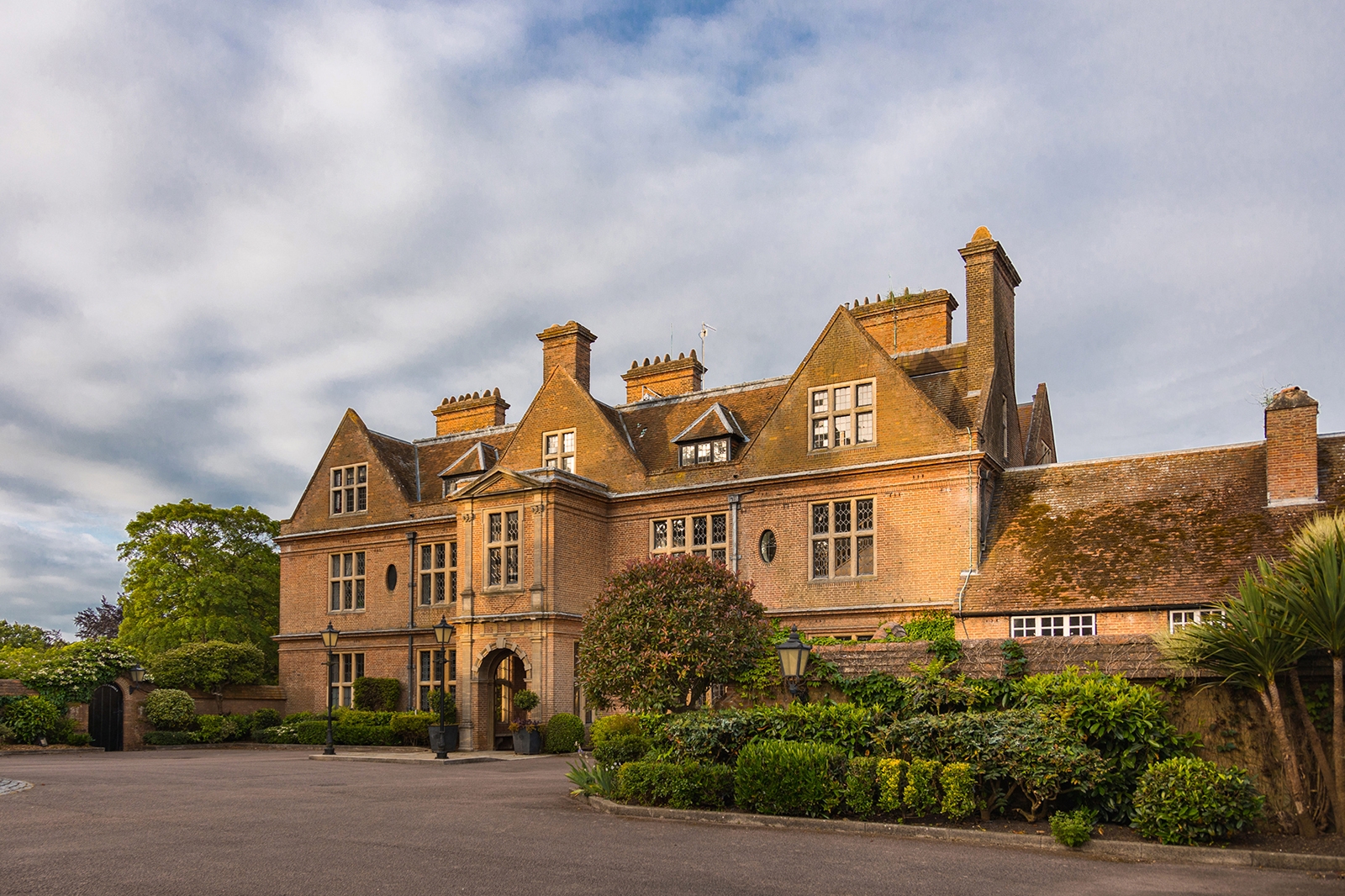 the large Horwood House with a cloudy sky