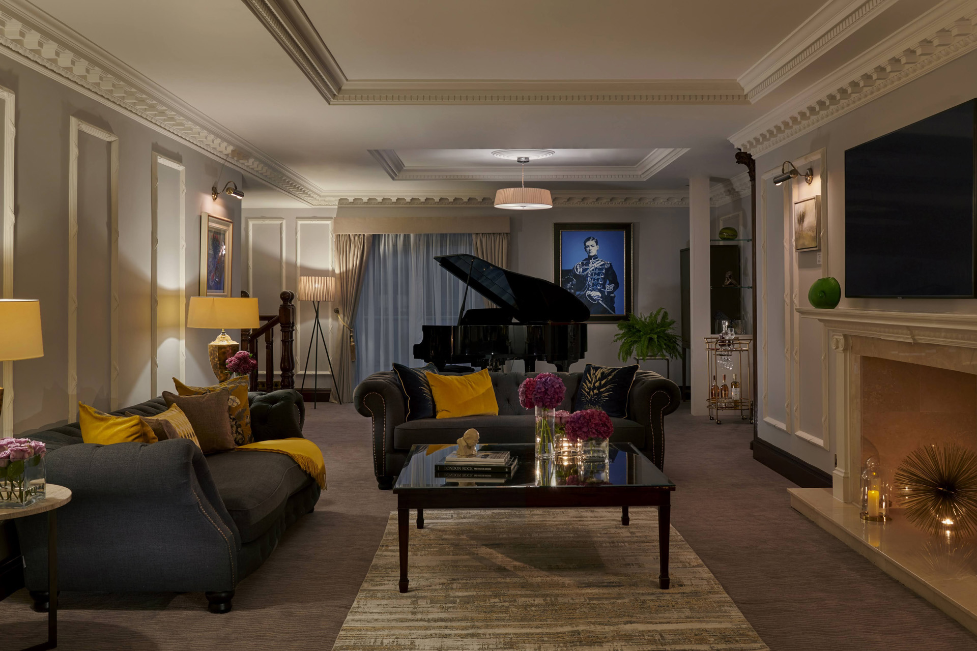 a cosy living room with sofas and grand piano