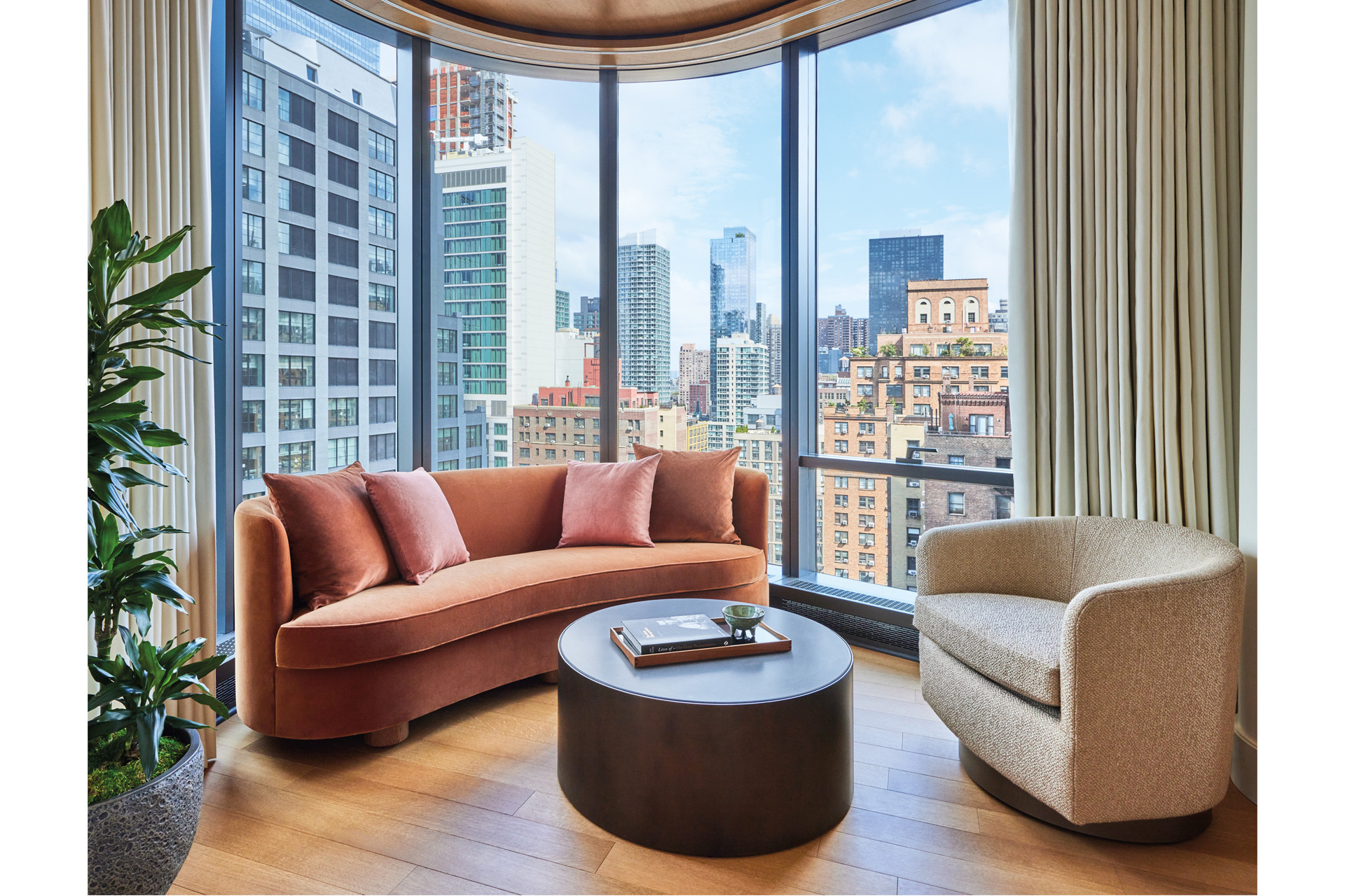 a sitting area with a view of the new york skyline