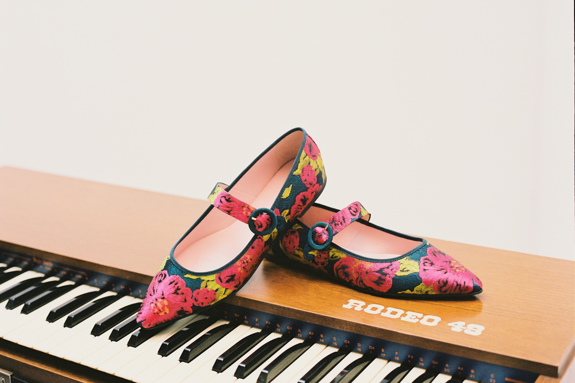 Ballet flats set on piano keyboard