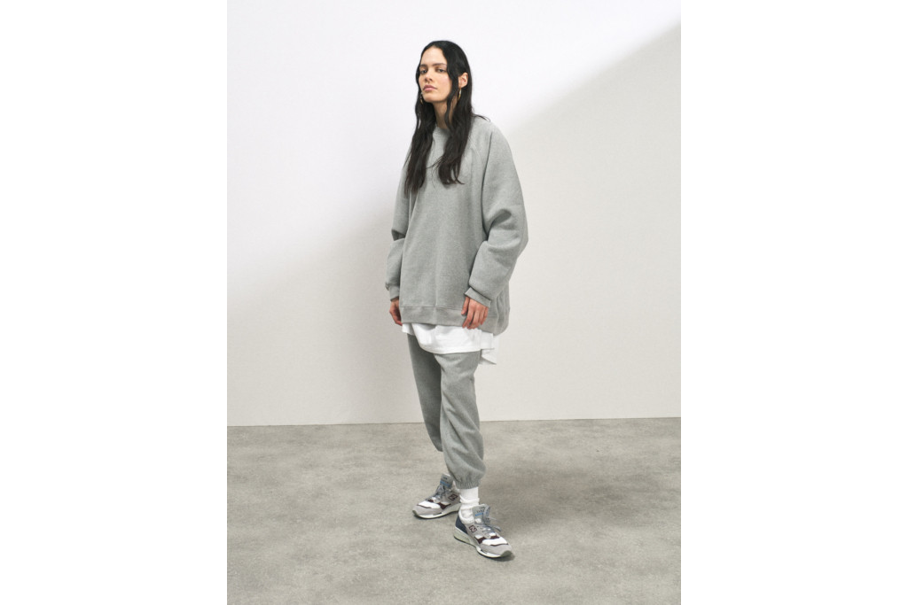 Woman in grey jumper and joggers