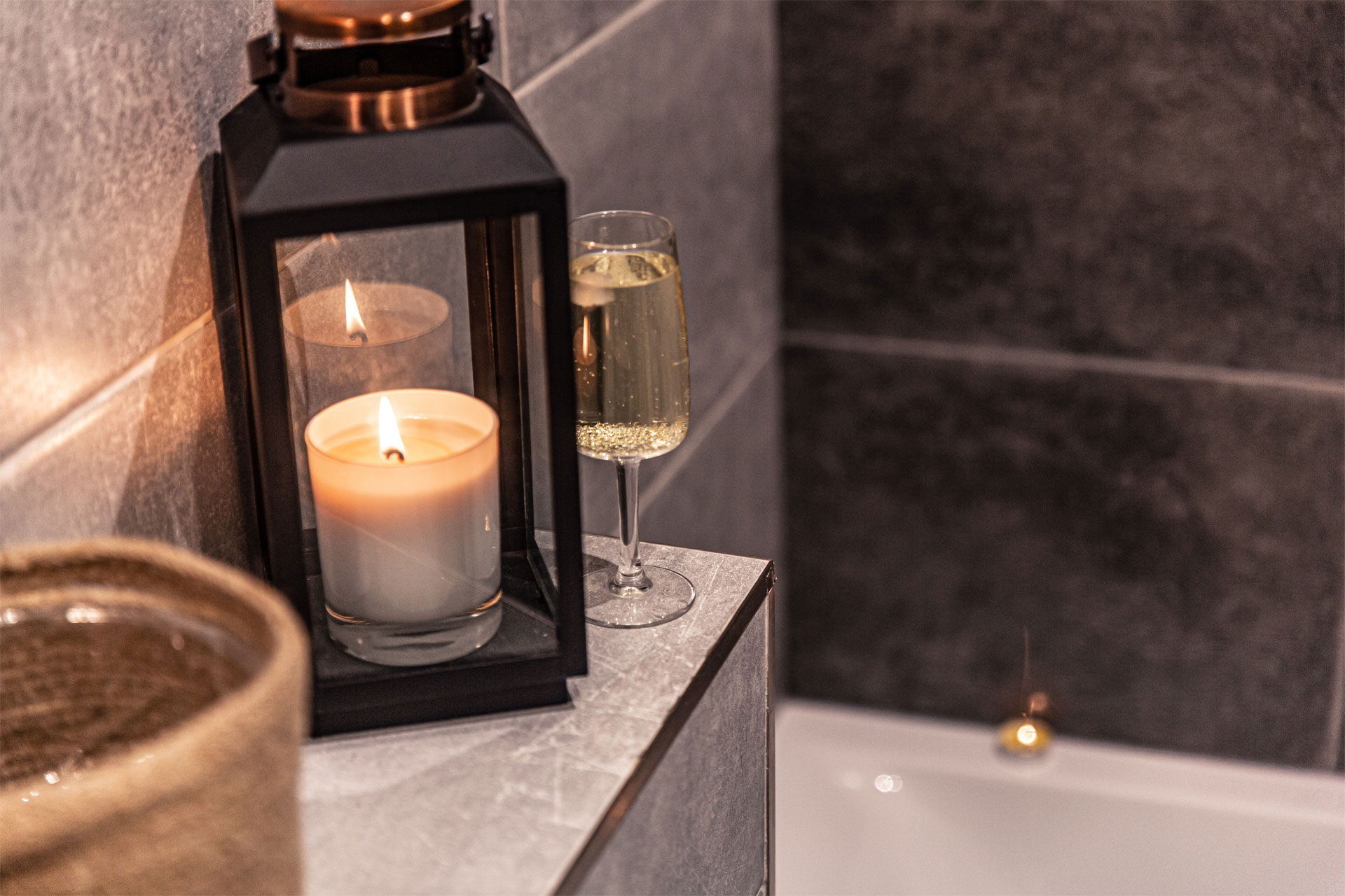 Close up of candles and lanterns by bath