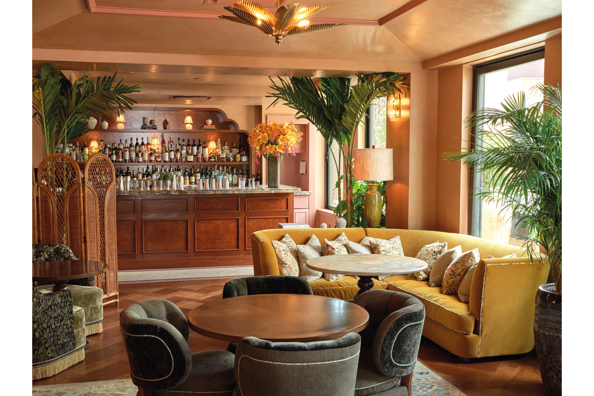 a bar decorated in brown, bronze and neutral tones