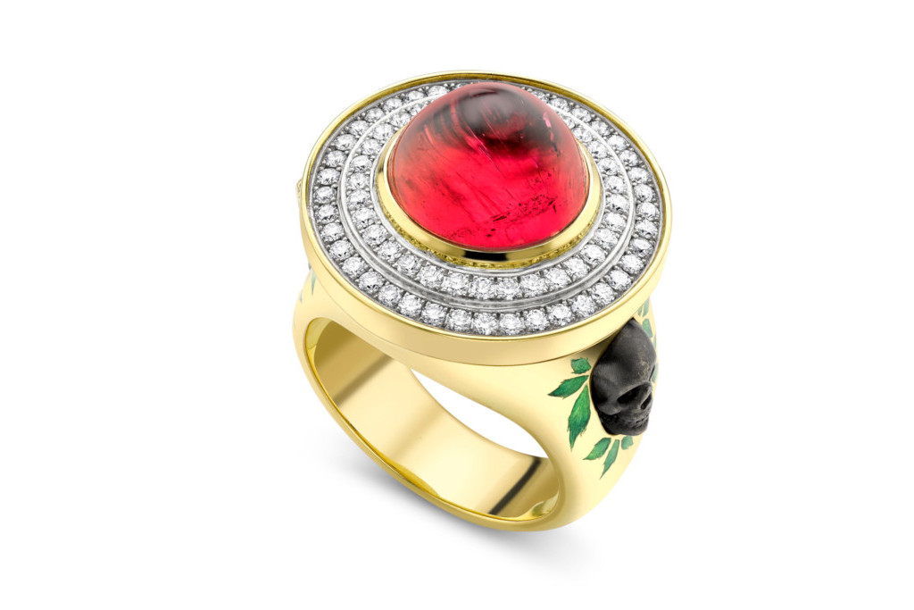 Gold with with black skull and red stone