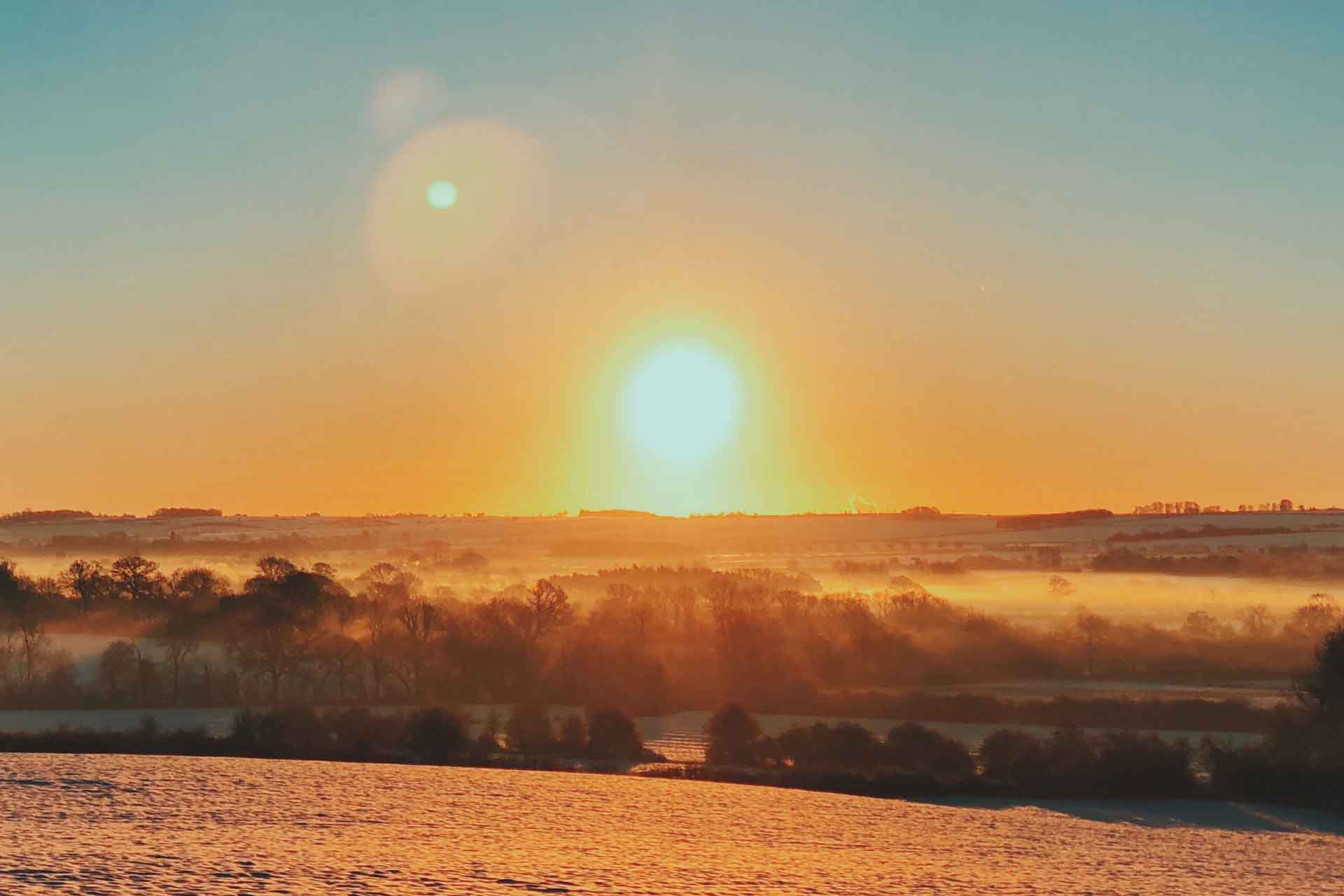 Snowy sunset over Cotswolds