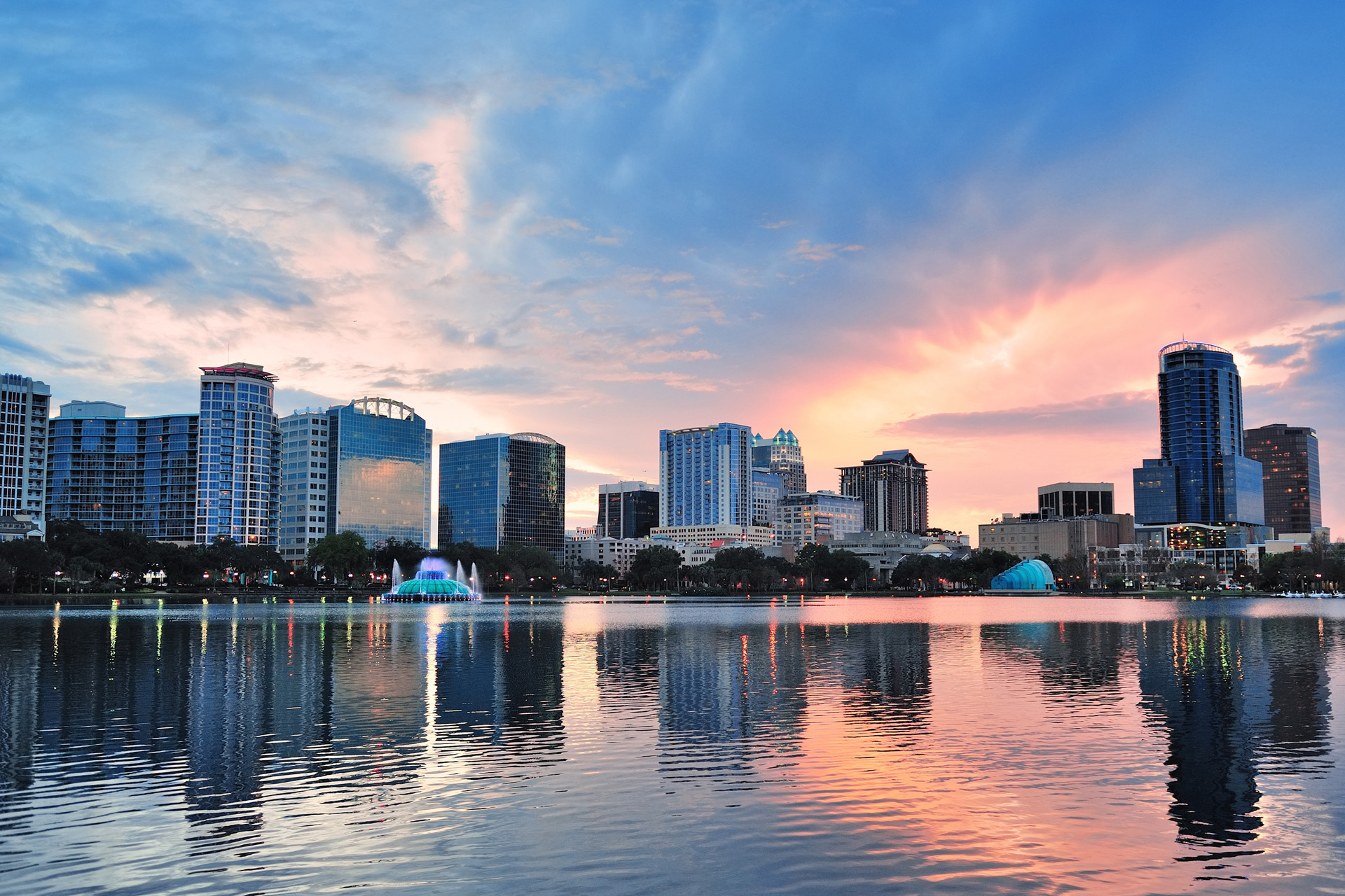 Orlando Lake Eola sunset with urban architecture skyline and colorful cloud